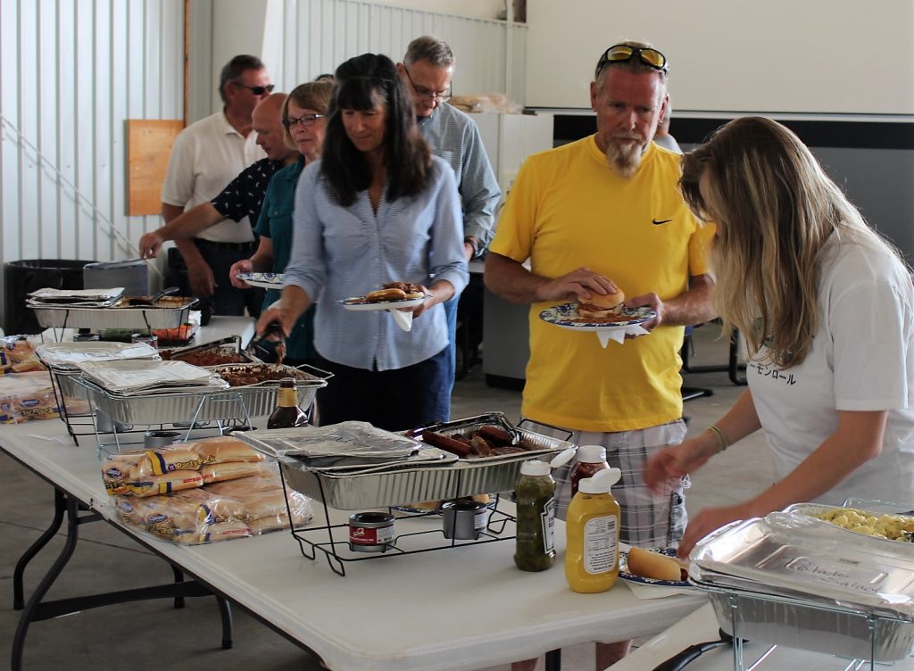 Direct Connect Flight Academy open house attendees enjoy BBQ.